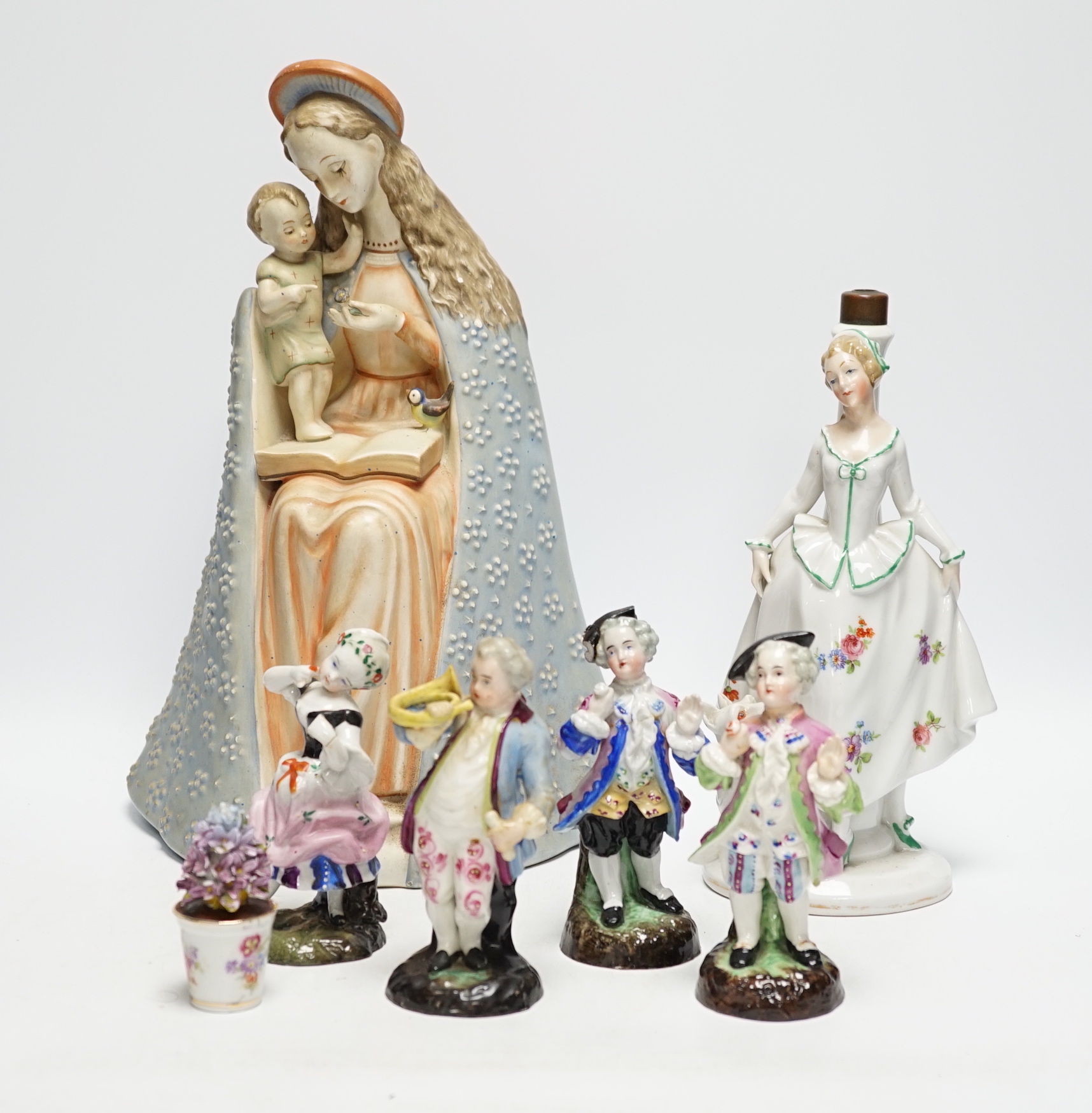 Mixed ceramics; a Madonna and child group, a jug, a pair of Sitzendorf miniature flower encrusted vases, nine small German style figures, etc. (18)